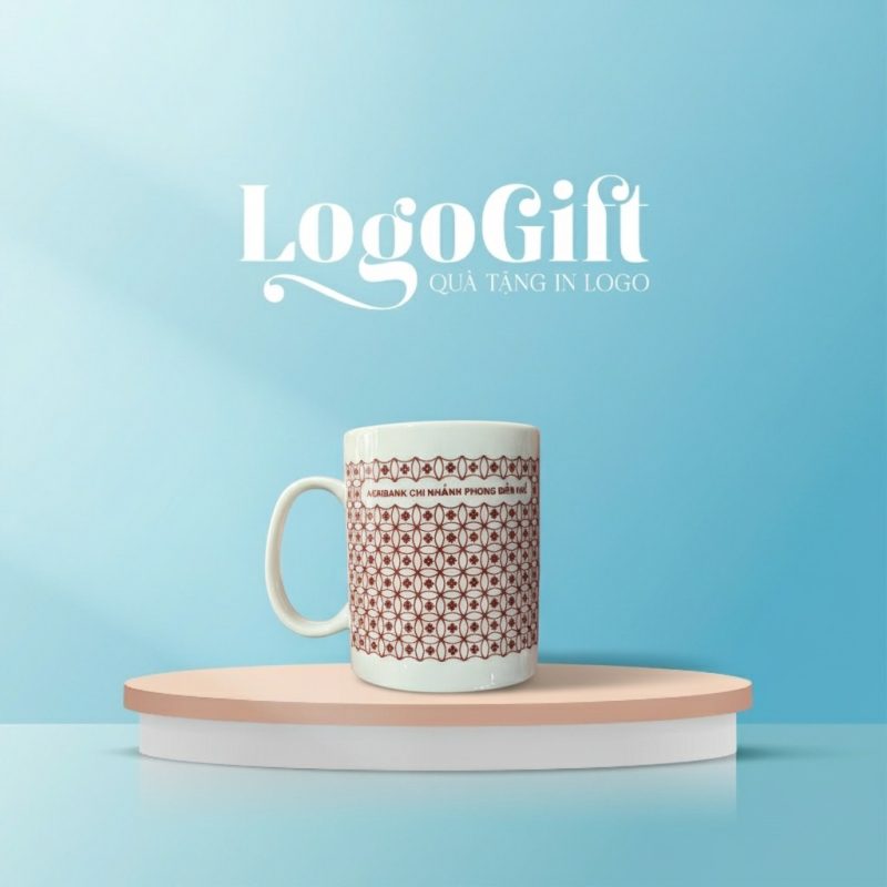 Cốc sứ quà tặng in logo dáng trụ quai C hoa lưới đỏ LG-CS19